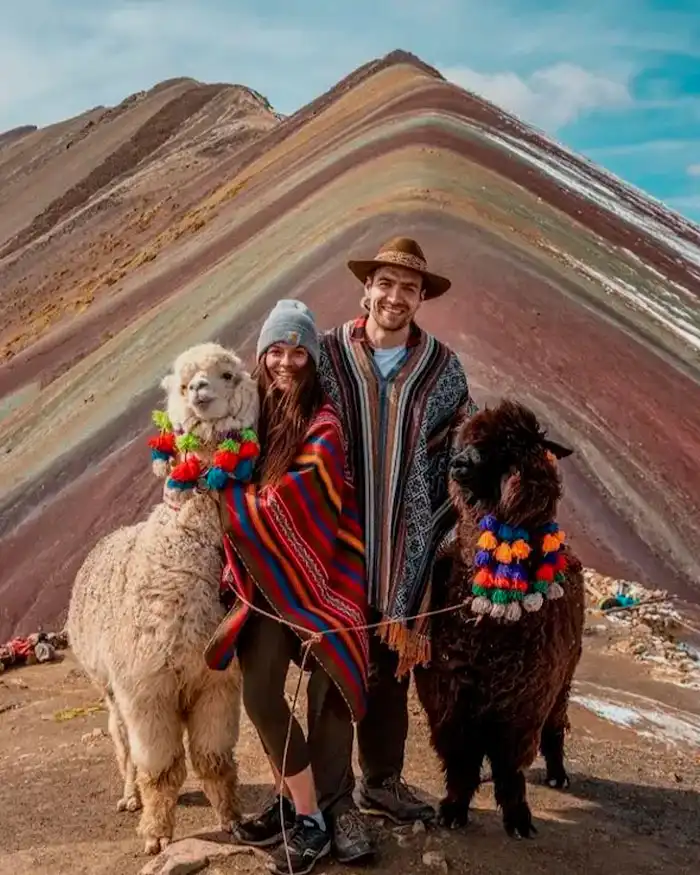 Couple enjoying the view at Rainbow Mountain in Peru