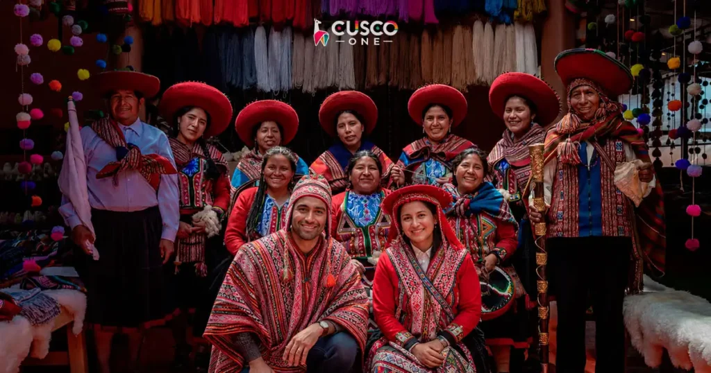 Travelers wearing traditional Andean clothing with local artisans in Peru