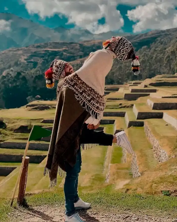Couple enjoying the view at Rainbow Mountain in Peru